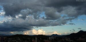 The frolic of sun and clouds.